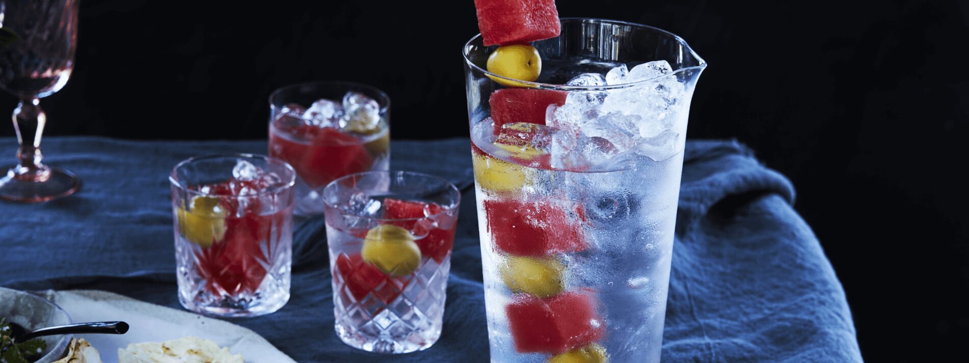 MARTINI WITH WATERMELON AND OLIVE GARNISH